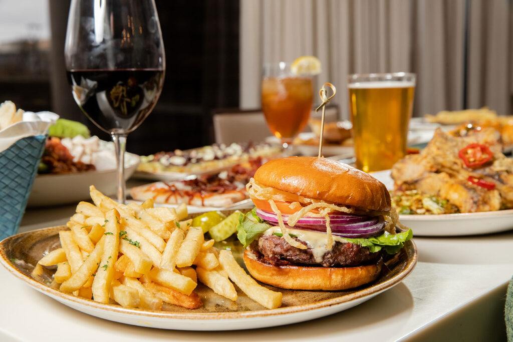 Burger, French Fries & drinks on table